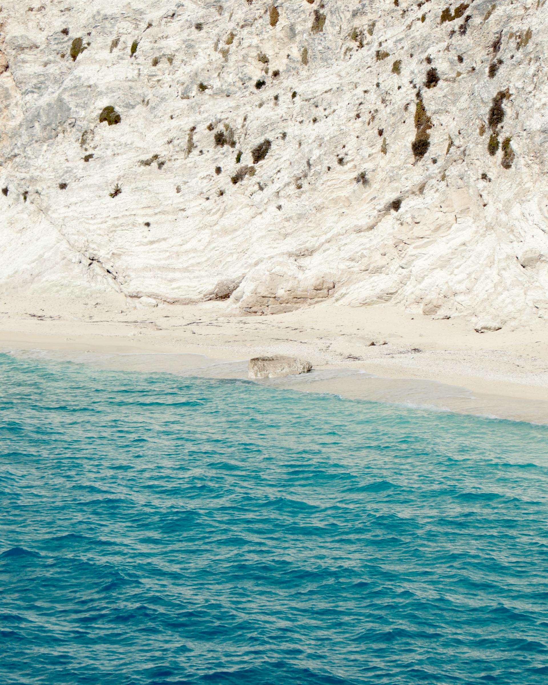 White limestone cliffs meeting turquoise sea